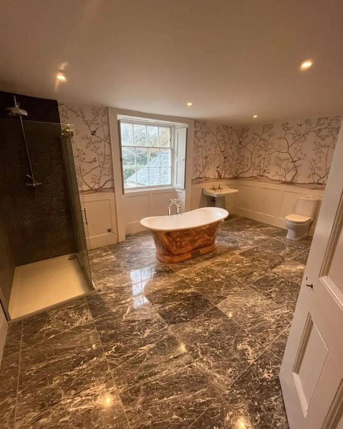 Luxury bathroom installation by SWW Plumbing and Heating — freestanding bath and marble tiling