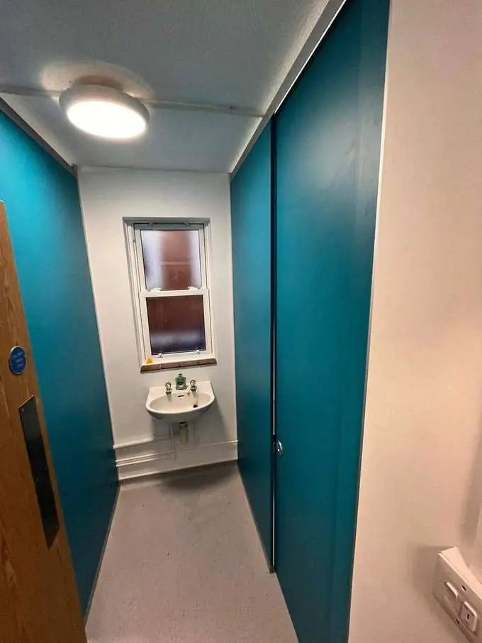 New teal cubicle system with fresh sink and decoration