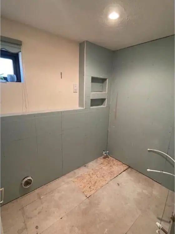 Walls re-boarded and prepped with niches formed